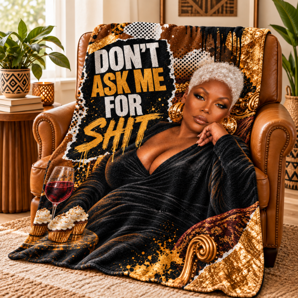 Flannel throw blanket with Don’t Ask Me for Shit artwork of a silver-haired Black woman, draped over a leather armchair